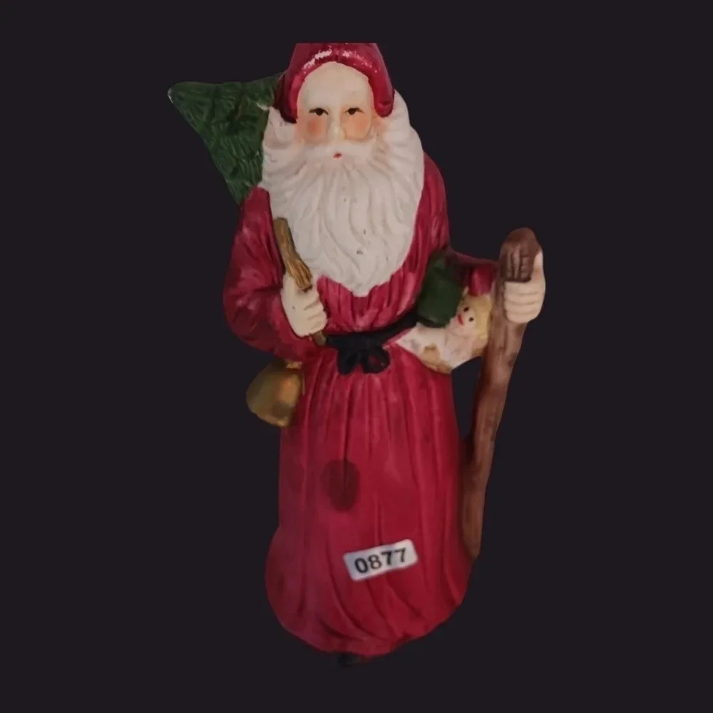 Santa fugurine with bell and christmas tree christmas decor